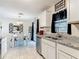 Bright kitchen features granite countertops, stainless appliances, and a spacious dining area at 278 Silverstone Dr, Orange City, FL 32763