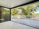Screened patio boasting a view of the property and surrounding trees at 278 Silverstone Dr, Orange City, FL 32763