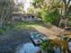 Backyard featuring a lakeside view with boats, providing an ideal outdoor retreat at 278 Silverstone Dr, Orange City, FL 32763