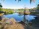 Picturesque waterfront with two boats ready for exploration along the tree lined shore at 278 Silverstone Dr, Orange City, FL 32763
