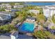 Aerial view of a community pool with lap lanes, pool house, and surrounding neighborhood at 2827 Upper Park Road, Orlando, FL 32814