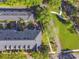 An aerial view of townhomes showcasing private garden patios and meticulous landscaping in a well maintained community at 2827 Upper Park Road, Orlando, FL 32814