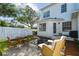 Relaxing backyard patio featuring comfortable seating and a charming white picket fence for privacy at 2827 Upper Park Road, Orlando, FL 32814