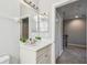 Modern bathroom with a mirror, bright lighting, and a small decorative plant at 2827 Upper Park Road, Orlando, FL 32814