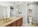 Bathroom featuring double sinks, modern fixtures, and a large mirror reflecting the interior at 2827 Upper Park Road, Orlando, FL 32814