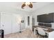 Bedroom showcasing a work station with a large TV, dual monitors, and a walk-in closet at 2827 Upper Park Road, Orlando, FL 32814