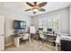 Bedroom set up as a home office space, complete with dual monitors and a bright ceiling fan at 2827 Upper Park Road, Orlando, FL 32814