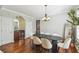 Elegant dining room featuring hardwood floors, modern lighting, and a view of the bar at 2827 Upper Park Road, Orlando, FL 32814