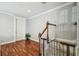 Entryway showcases hardwood flooring, decorative molding, and a staircase with a safety gate at 2827 Upper Park Road, Orlando, FL 32814