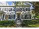 Charming two-story home with a beautiful lawn and dark shutters accenting the windows at 2827 Upper Park Road, Orlando, FL 32814
