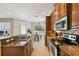 Functional kitchen space with granite countertops and stainless steel appliances at 2827 Upper Park Road, Orlando, FL 32814