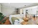 Inviting living room featuring hardwood floors, neutral paint, and views into dining area at 2827 Upper Park Road, Orlando, FL 32814