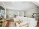 Bright living room with hardwood floors, neutral paint, white trim, and cozy, white sectional sofa at 2827 Upper Park Road, Orlando, FL 32814