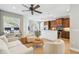 Bright living space showcasing the open-concept design with the kitchen at 2827 Upper Park Road, Orlando, FL 32814