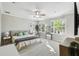 Spacious main bedroom with plantation shutters, carpet flooring and a ceiling fan at 2827 Upper Park Road, Orlando, FL 32814