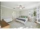 This main bedroom features plantation shutters, walk-in closet and ensuite bathroom at 2827 Upper Park Road, Orlando, FL 32814
