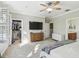 Comfortable primary bedroom with plantation shutters, ensuite bathroom and walk-in closet at 2827 Upper Park Road, Orlando, FL 32814