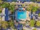 Aerial view of the community pool and surrounding amenities including ample seating at 2827 Upper Park Road, Orlando, FL 32814