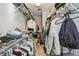 Organized walk-in closet with ample hanging space, shelving, and room for storage baskets at 2827 Upper Park Road, Orlando, FL 32814
