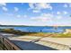 Scenic waterfront view of a serene lake with a gazebo, offering tranquil outdoor recreational opportunities at 2827 Upper Park Road, Orlando, FL 32814
