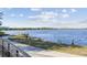 Scenic waterfront view of a serene lake with a gazebo, offering tranquil outdoor recreational opportunities at 2827 Upper Park Road, Orlando, FL 32814