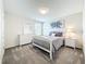 Calm bedroom features soft carpet, a comfy bed, dresser, and a bright window at 2861 Black Birch Dr, Ocoee, FL 34761