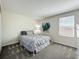 Cozy bedroom with a comfortable bed, soft carpet, and a bright window at 2861 Black Birch Dr, Ocoee, FL 34761