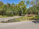 Arden Park community entrance sign surrounded by mature trees, manicured lawns and flowering shrubbery at 2861 Black Birch Dr, Ocoee, FL 34761