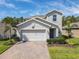 Charming two-story home with a two car garage, paver driveway and a well maintained landscaped yard at 2861 Black Birch Dr, Ocoee, FL 34761