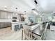 Open-concept kitchen with island, dining area, and pendant lighting fixtures at 2861 Black Birch Dr, Ocoee, FL 34761