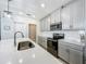 Bright kitchen with stainless steel appliances, subway tile backsplash and stone countertops at 2861 Black Birch Dr, Ocoee, FL 34761