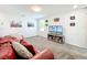 Relaxing living room area with comfortable seating, wall art, and entertainment center at 2861 Black Birch Dr, Ocoee, FL 34761