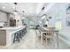 Open concept living space featuring a dining area, living room and eat in kitchen island at 2861 Black Birch Dr, Ocoee, FL 34761