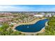 Beautiful aerial view showcasing homes near a scenic lake and city at 2898 Oakwater Dr # 2898, Kissimmee, FL 34747