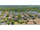 Scenic aerial view of homes nestled around a serene lake surrounded by lush greenery at 2898 Oakwater Dr # 2898, Kissimmee, FL 34747