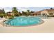Community pool featuring lounge chairs and well-maintained landscaping at 2898 Oakwater Dr # 2898, Kissimmee, FL 34747