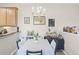 Dining room featuring a table with seating for four, adjacent to open kitchen at 2898 Oakwater Dr # 2898, Kissimmee, FL 34747