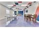 Bright game room featuring a ping pong table, pool table, and an inviting dining set at 2898 Oakwater Dr # 2898, Kissimmee, FL 34747