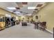 Well-lit game room with pool table, vintage arcade games, and comfortable seating at 2898 Oakwater Dr # 2898, Kissimmee, FL 34747