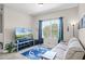 Inviting living room with large window, sofa, and modern entertainment center at 2898 Oakwater Dr # 2898, Kissimmee, FL 34747