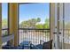 Cozy patio with seating area and view of palm trees at 2898 Oakwater Dr # 2898, Kissimmee, FL 34747