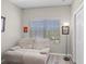 A comfy sitting area with a loveseat by a window, and a reading lamp next to a closet at 2898 Oakwater Dr # 2898, Kissimmee, FL 34747