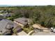 An aerial view of a well-maintained home with a brick driveway and a neatly landscaped yard at 2933 Star Grass Pt, Oviedo, FL 32766
