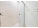 Bathroom shower featuring a sliding glass door and clean, neutral tile work at 2933 Star Grass Pt, Oviedo, FL 32766