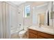 Bright bathroom featuring a shower over tub combination and neutral wall color at 2933 Star Grass Pt, Oviedo, FL 32766
