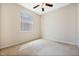 Cozy bedroom with neutral carpet, a window with blinds, and a ceiling fan at 2933 Star Grass Pt, Oviedo, FL 32766