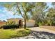 Inviting single-story home featuring a brick driveway, two-car garage, and lush green landscaping at 2933 Star Grass Pt, Oviedo, FL 32766
