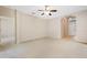 Bright living room with neutral carpet, archways, and a view to the front entrance at 2933 Star Grass Pt, Oviedo, FL 32766