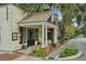 Quaint building exterior with a welcoming entrance, featuring classic columns and lush landscaping at 33332 Seattle Slew Dr, Sorrento, FL 32776
