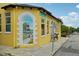 A brightly colored yellow building with a painted mural advertising Pedego electric bikes and Segway rentals at 33332 Seattle Slew Dr, Sorrento, FL 32776